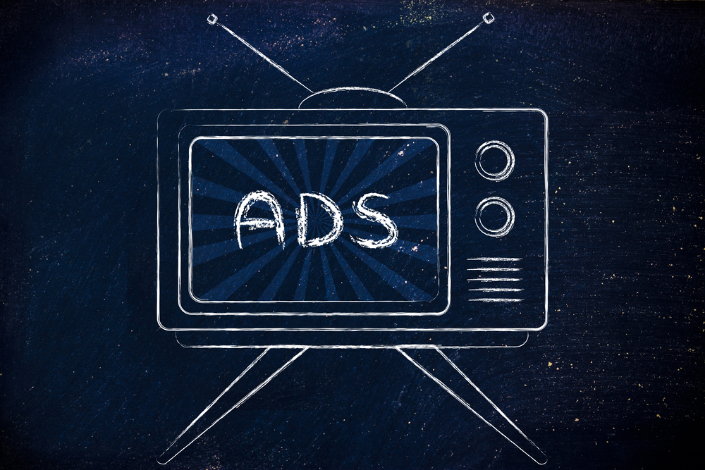 A white illustration of a retro-tv with the word "ads" in a script font in the middle of the screen over a blue and black background 
